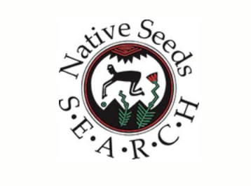 A circular logo with the text reading "Native Seeds. S-E-A-R-C-H" around the circle. Inside the circle is a stylized, black human figure burying a green seed among two growing plants. A red stylized sun shines above the scene. 